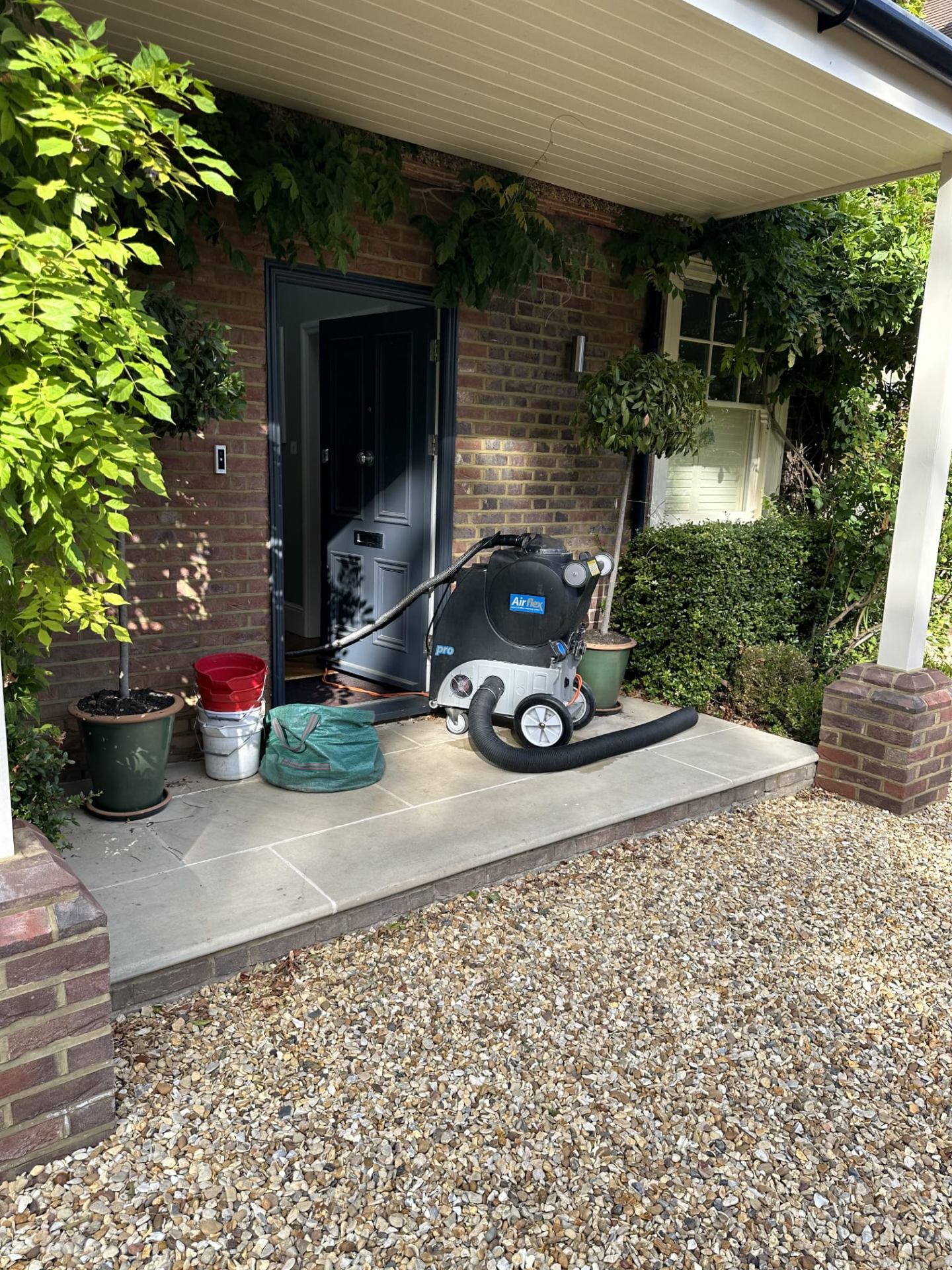 Airflex professional carpet cleaning machine at customer doorstep ready for service