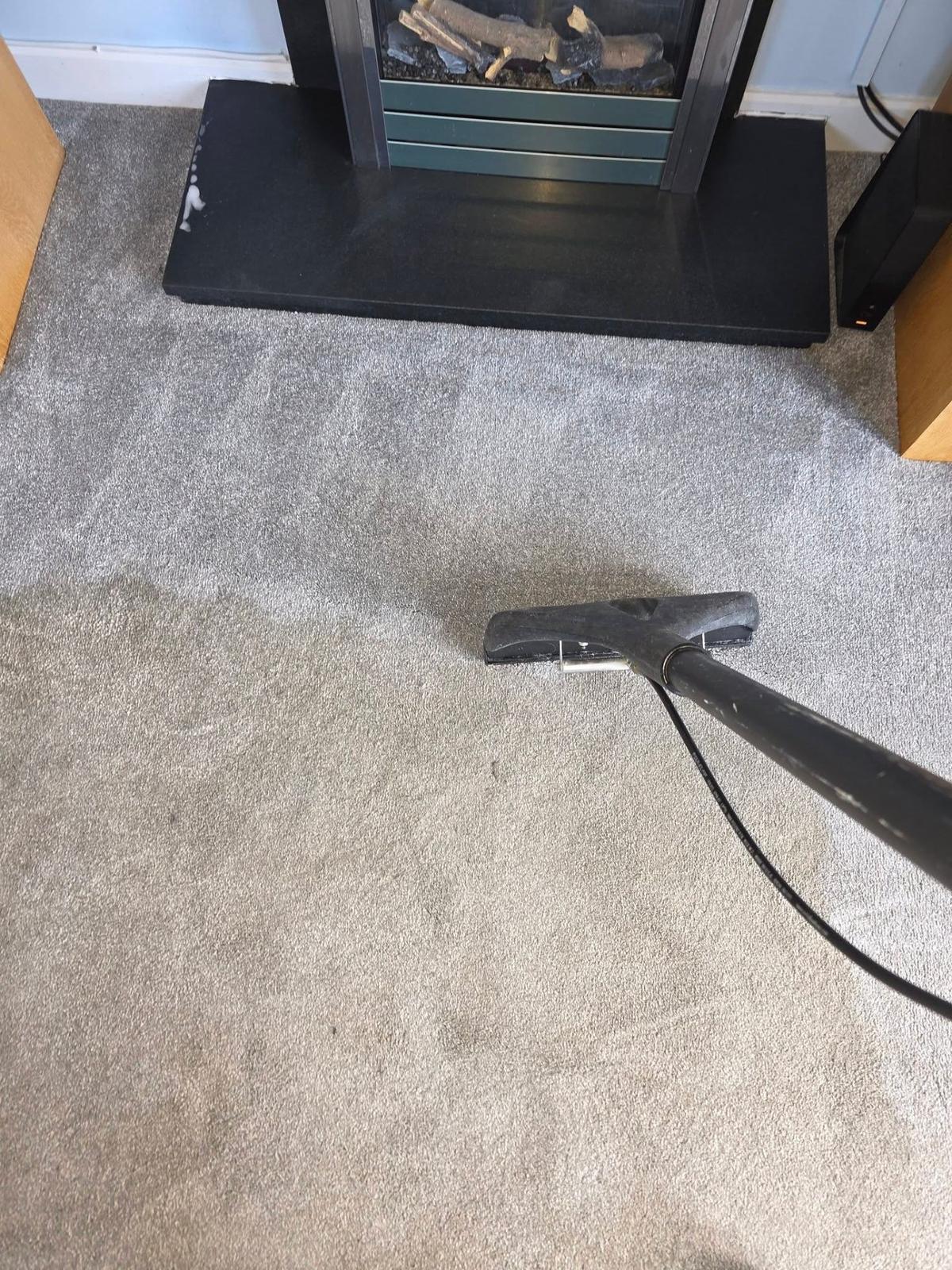 Professional carpet cleaning with extraction wand in Aylesbury home