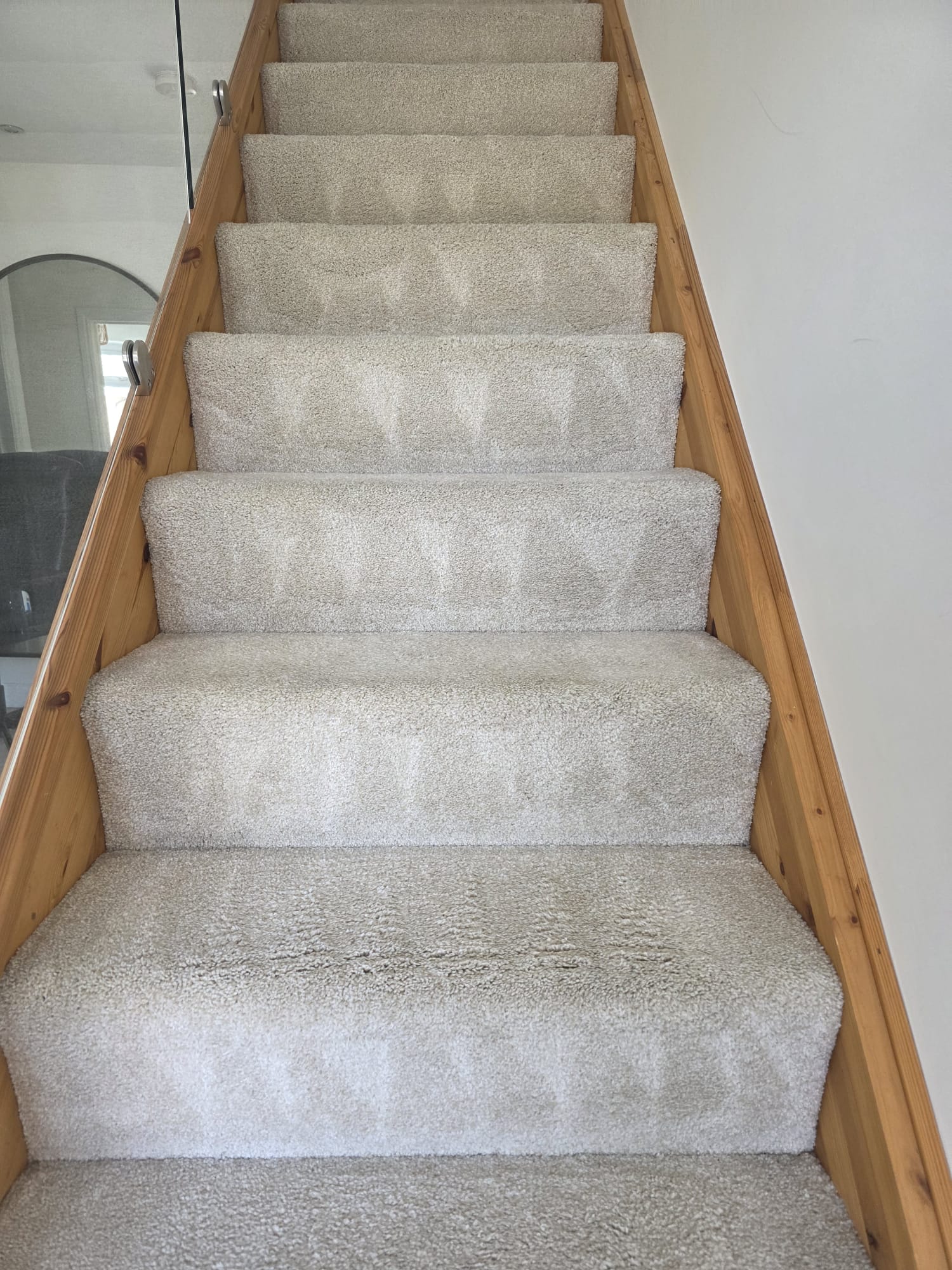 Cream staircase carpet freshly cleaned and restored to bright condition